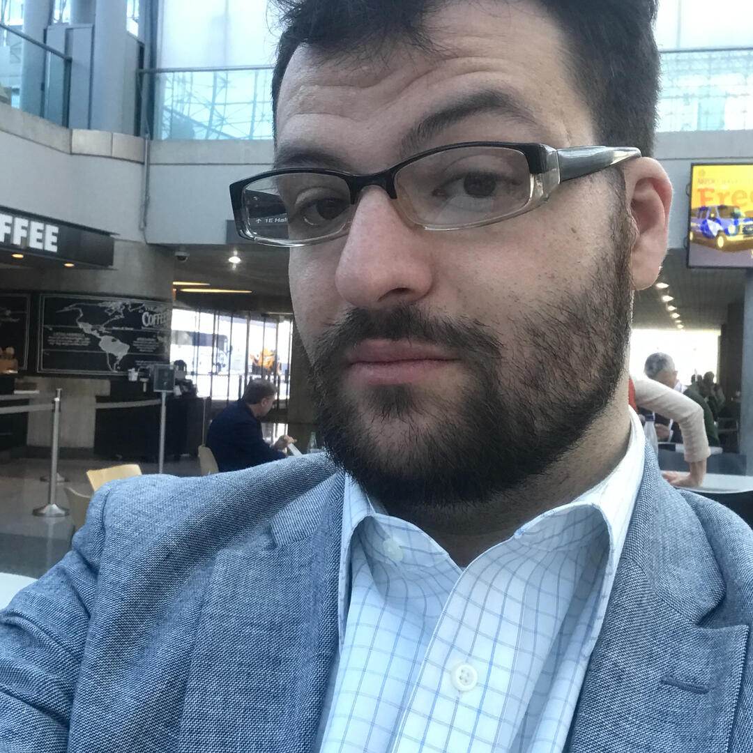 Zach at a Wine Event Zach is very handsome in a suit with his styled beard